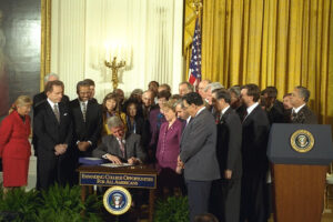 President Clinton signs the "Higher Education Amendments of 1998" (October 7, 1998).